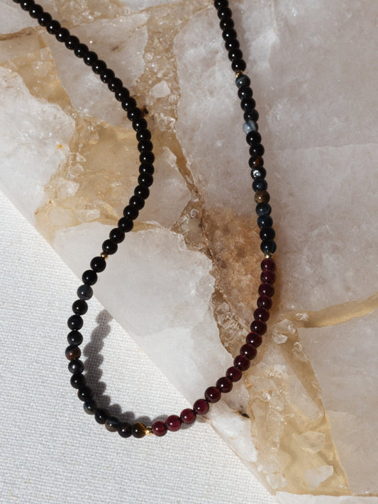 Noir Fine Jewelry Déesse Sombre Gemstone Necklace made with Obsidian, Garnet and Tigers Eye gemstones and solid 14k gold